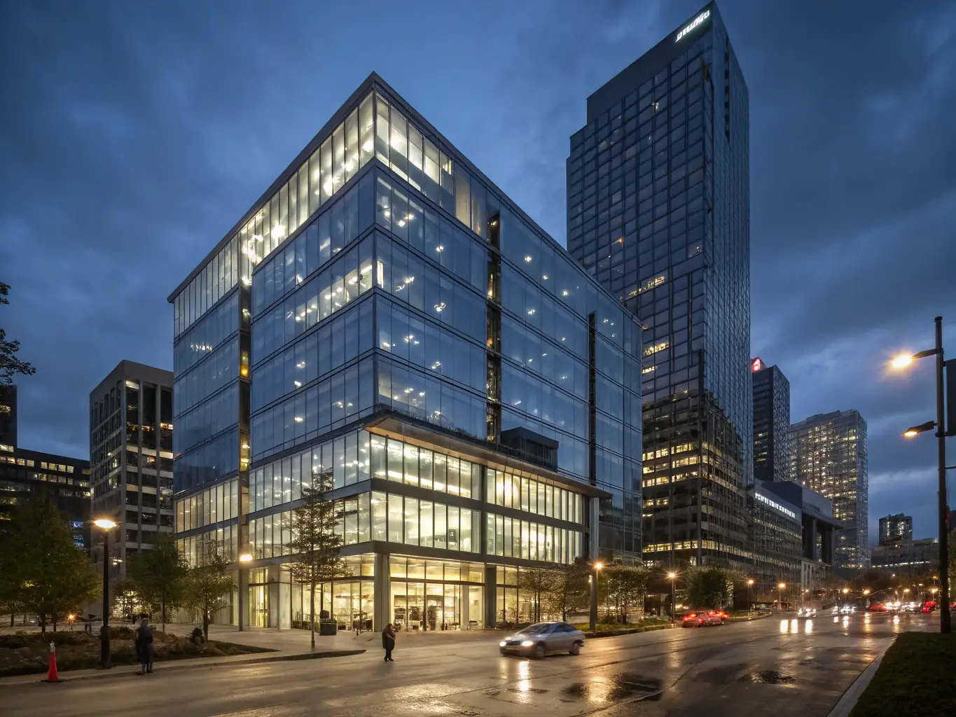 A commercial building facade featuring a modern curtain wall system with reflective glass panels, showcasing advanced glazing technology.